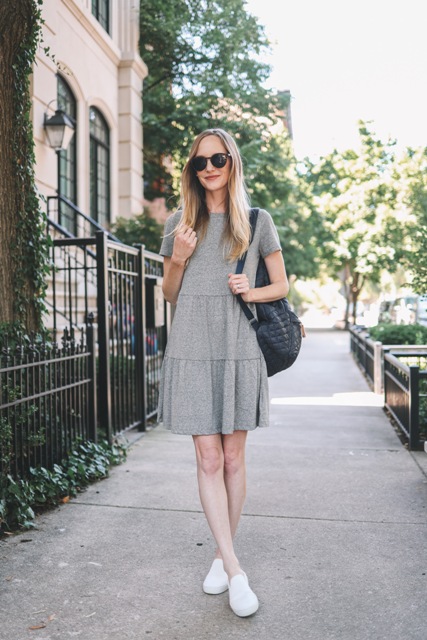 With sunglasses, black leather backpack and white flat shoes