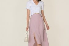 With white crop shirt, earrings, beige leather mini bag and beige shoes