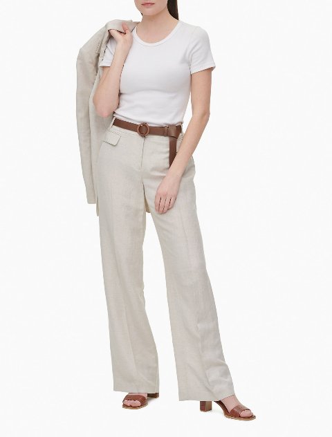 With white t-shirt, beige blazer, brown leather belt and brown leather heeled shoes