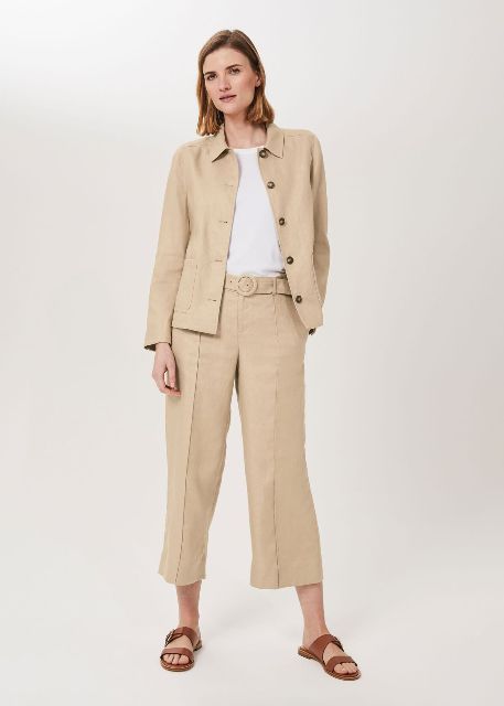 With white t-shirt, beige linen jacket and brown leather flat sandals