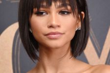Zendaya rocking a black liqud bob with a feathered fringe and side bangs looks jaw-dropping