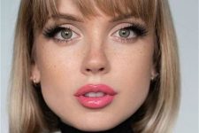 a beautiful natural blonde liquid bob with a classic fringe looks retro-inspired and extremely chic