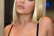 a bold creamy blonde liquid long bob by Kylie Jenner is a catchy and chic idea for a modern and bold look