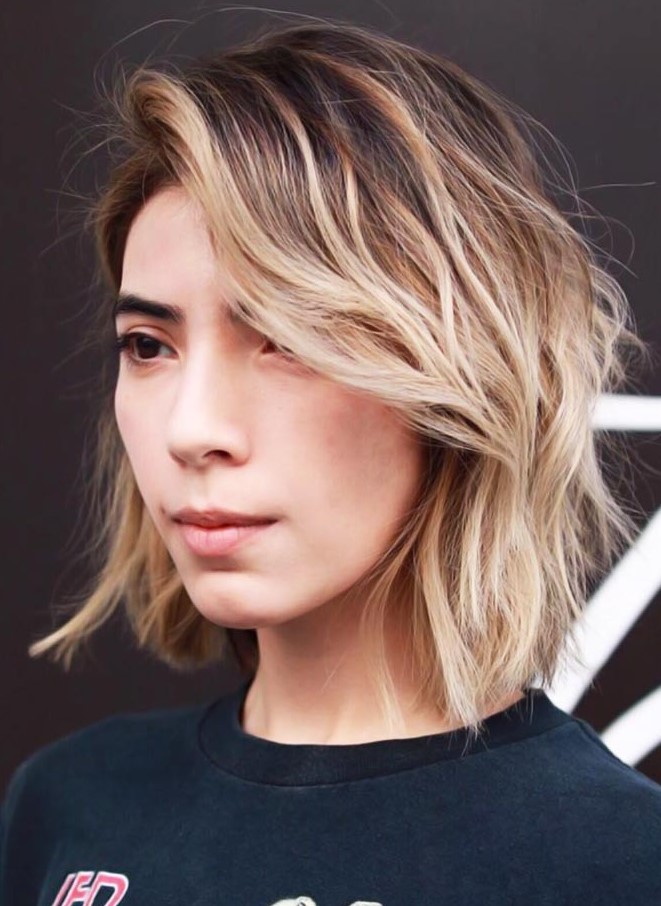 a blonde bob with long feathered layered and a lot of volume is a chic and lovely idea for a girl who can't choose a tone
