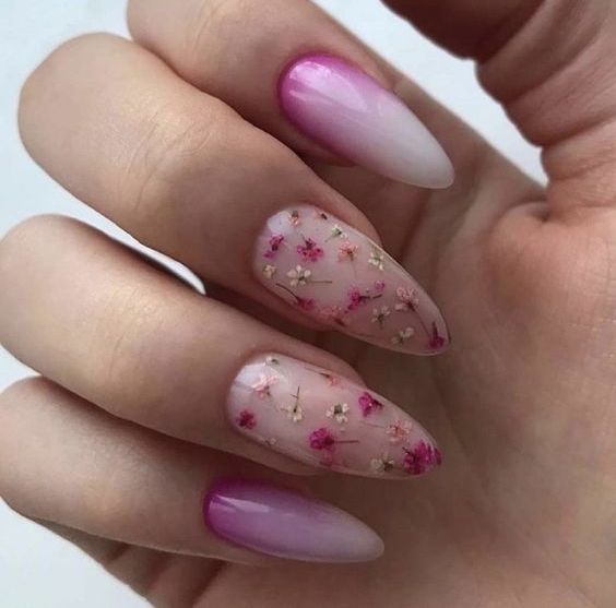 a catchy ombre purple to white manicure with blush nails accneted with neutral and pink dried blooms for summer