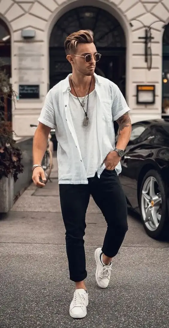 a catchy summer layering look with a white top and a linen short sleeve shirt, black pants and white sneakers