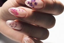 a chic blush manicure with colorful pressed blooms of purple and pink shades is a beautiful and girlish idea for summer