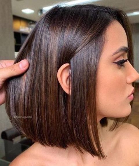 a chic deep brown liquid long bob with central parting and a bit of caramel balayage is an amazing idea