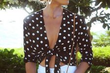a classy summer look with a black polka dot tie top, white jeans, a small brown bag and statement earrings
