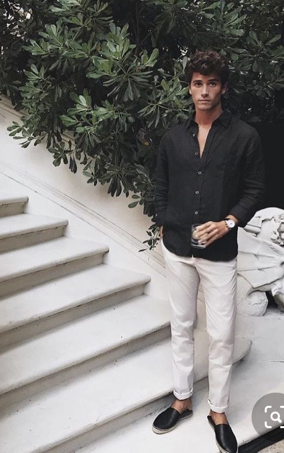 a contrasting summer outfit with a black linen shirt, neutral pants and black espadrilles for parties