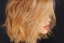 a ginger uneven layered bob with blonde belayage looks super sexy and dramatic and will catch all the eyes