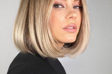a gorgeous blonde liquid bob with a darker root and wavy ends is a chic and timeless idea that always works