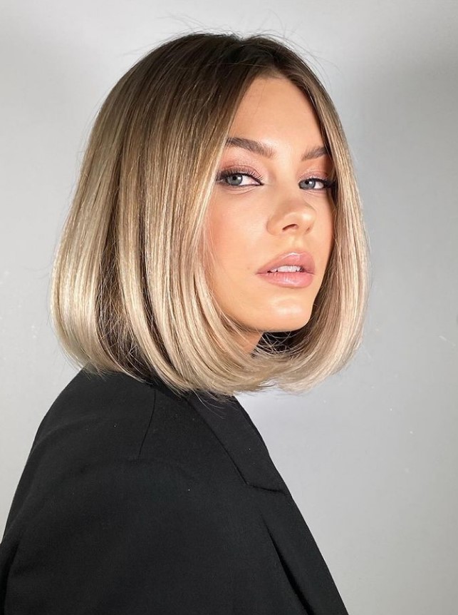a gorgeous blonde liquid bob with a darker root and wavy ends is a chic and timeless idea that always works