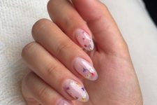 a lovely blush semi-sheer manicure decorated with colorful dried flowers is a fantastic idea for a bride