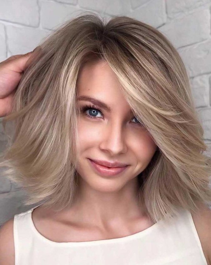 a multi-dimensional haircut with several tones and layers is perfect for fine hair to add volume and texture