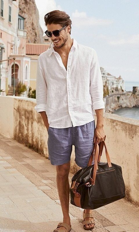 a relaxed vacation look with a white linen shirt, blue line shorts, neutral birkenstocks and a dark bag