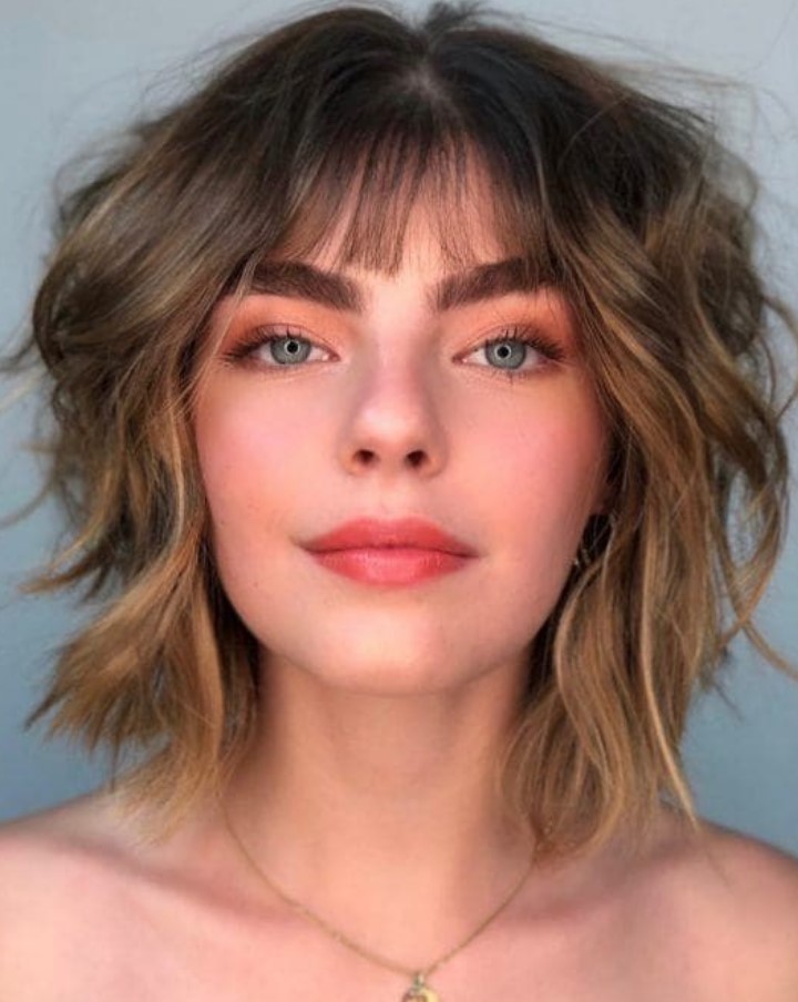 a shaggy layered bob with a wispy fringe and a bit of balayage looks fresh and edgy