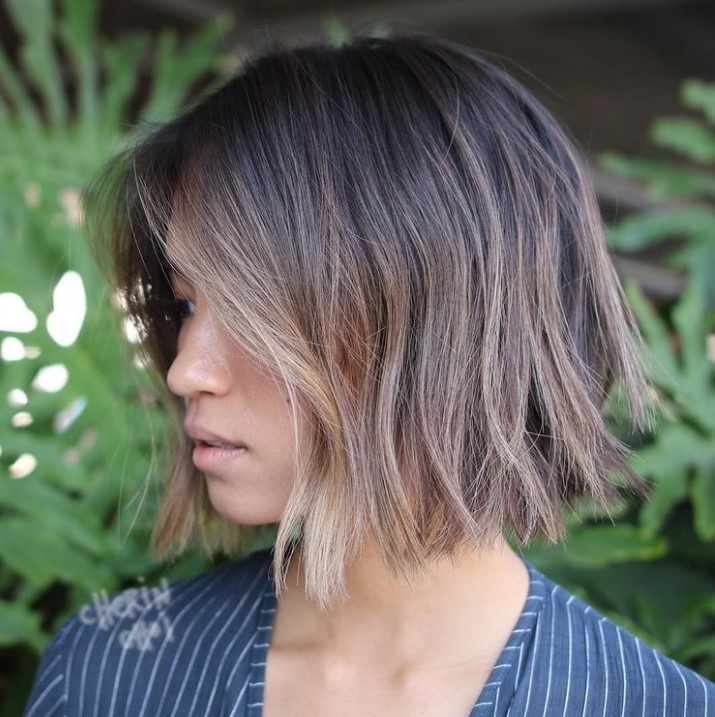 a straight cut layered bob with a darker root and babylights is a fantastic idea to illuminate your face