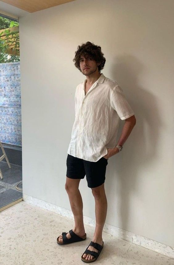 a summer vacation look with a white linen shirt, black shorts and black birkenstocks is super easy and lovely