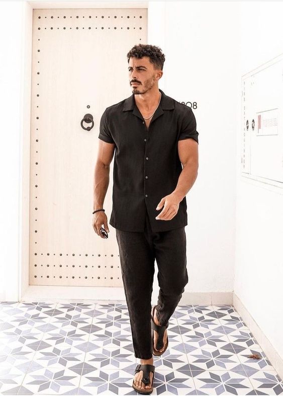 a total black summer look with a linen shirt and pants and catchy minimalist sandals
