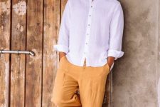 a white linen shirt with contrasting buttons, yellow linen pants and neutral espadrilles for a hot summer