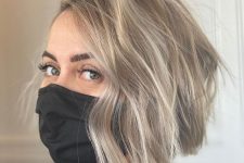 an ash blonde layered bob looks trendy, bold and very modern and makes you stand out with a fashionable tone