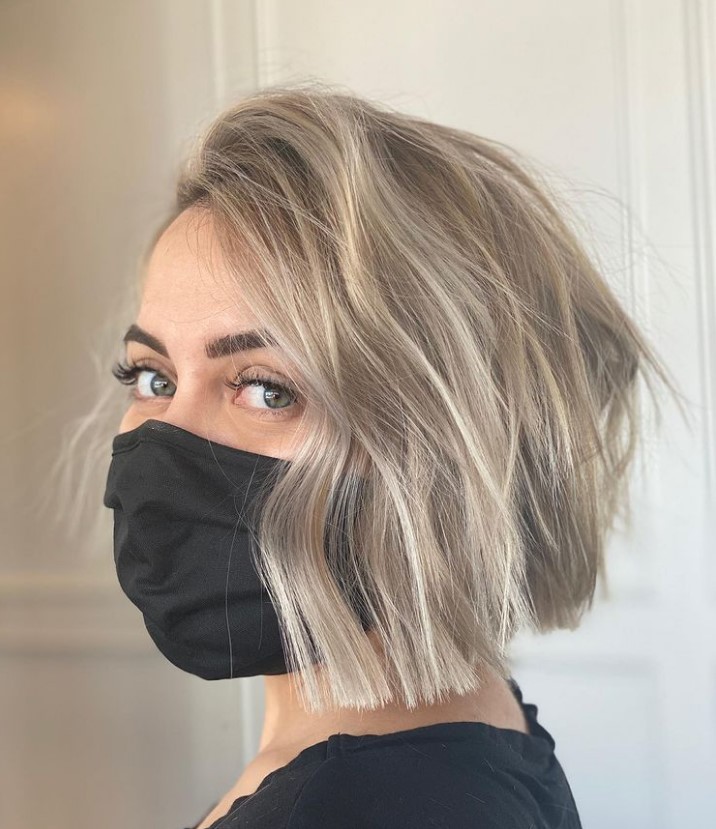 an ash blonde layered bob looks trendy, bold and very modern and makes you stand out with a fashionable tone
