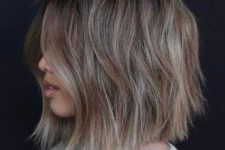 an ashy bob haircut with layers goes perfect, it looks very refreshing and illuminates the face with highlights around it