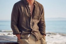 an earthy-tone look with a brown linen shirt and beige cotton shorts with pockets is a cool idea for a relaxed vacation