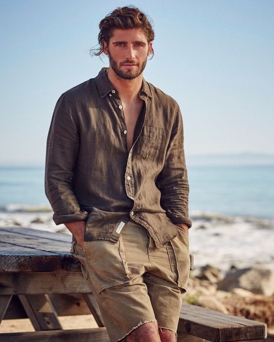 an earthy tone look with a brown linen shirt and beige cotton shorts with pockets is a cool idea for a relaxed vacation