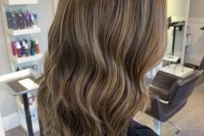 golden brown medium-length hair with delicate blonde babylights that refresh the look and give interest to the main color