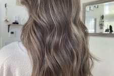 light brunette hair with blonde babylights that help create a bolder and more dimensional look