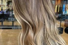 light brunette long hair with blonde balayage and babylights that refresh the look and make it bolder and catchier