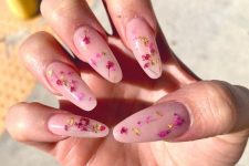 long coffin-shaped nails in blush accented with hot pink and purple dried blooms and gold leaf are great for a refined look
