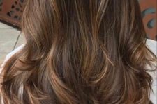 long dark brown hair with delicate caramel babylights and mathing ends for a dimensional and eye-catchylook