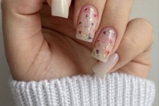 long milky nails accented with pink and purple dried blooms and gold leaf are amazing for a delicate spring look