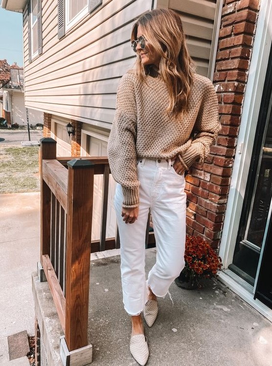 a casual neutral outfit with a tan sweater, white jeans, neutral slipper mules is a cozy and comfy idea