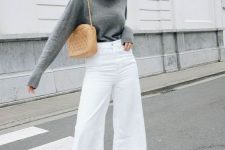 07 a cozy fall outfit with a grey jumper, white flare jeans, tan boots and a tan-colored bag is cool for every day