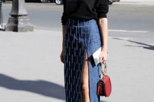 08 a refined date look with a black top, a denim midi skirt with beading, red shoes and a small red bag with a round handle