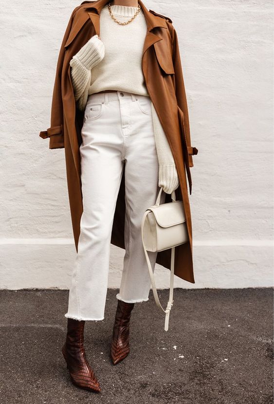 a fall look with a white sweater, white cropped jeans, burgundy boots, a tust leather trench and a creamy bag