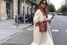 12 a white A-line midi dress, an oversized tan blazer, white trainers, a burgundy bag for a warm fall look