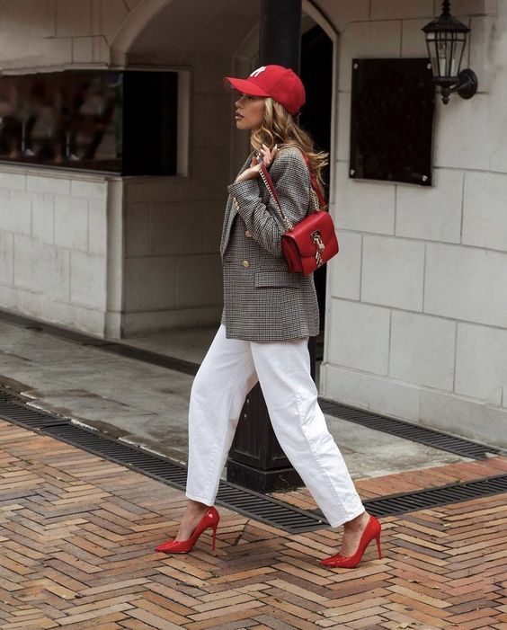 white wideleg jeans, an oversized grey plaid blazer, red shoes, a red bag and a red cap for a lovely sport look