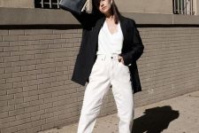 13 a fall work outfit with a white top, white cuffed jeans, black heeled mules, a black oversized blazer and a black bag