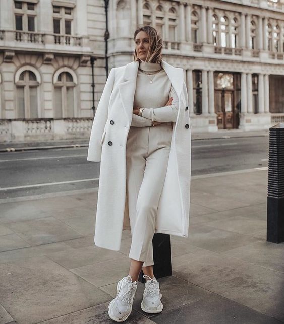 an all-white fall outfit with a turtleneck, cropped pants, white trainers, a midi coat is a great idea for every day or for work