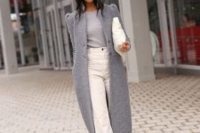 21 a sophisticated fall to winter look with a grey top, a grey maxi coat, white wide jeans, snakeskin printed boots and a white bag