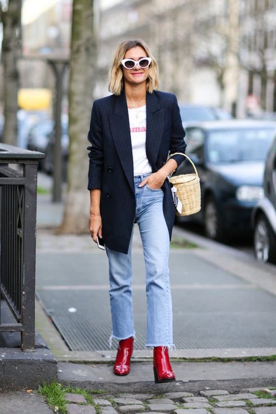 a simple and lovely fall look with a printed t-shirt, a black thin stripe blazer, blue jeans, hot red boots and a basket bag