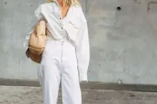 24 an early fall double denim look with an oversized denim shirt and white jeans, creamy boots and a tan bag