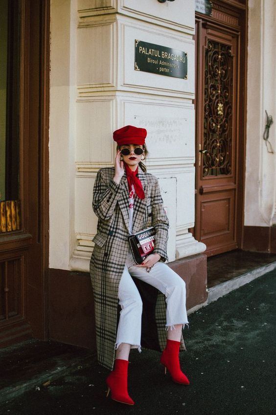 a white t shirt, white jeans, red sock boots, a plaid midi coat and a hot red cap for a bold fall look