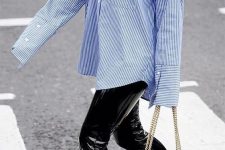 29 an oversized blue thin stripe shirt, black leather leggings, red boots, a black beaded bag for a chic fall look