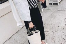 34 a striped top, a black denim midi skirt, a white denim jacket, white flats and a bucket bag